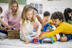 Children are playing, serving as a guide for choosing the right option of either part-time or full-time daycare.